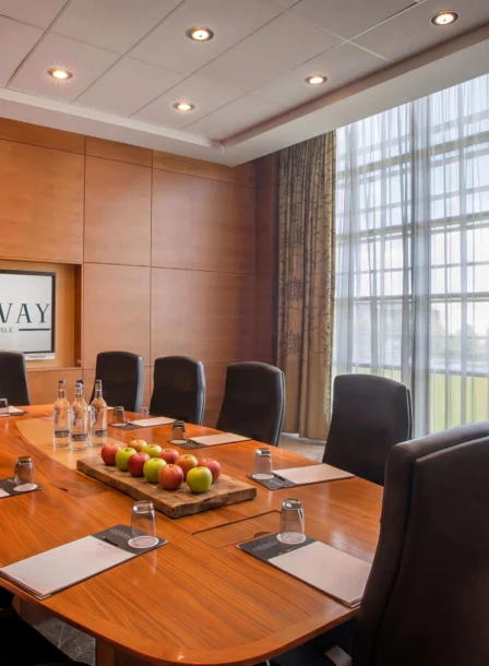Elegant conference room with a polished table, ready for a business meeting at The Gateway Hotel Dundalk.