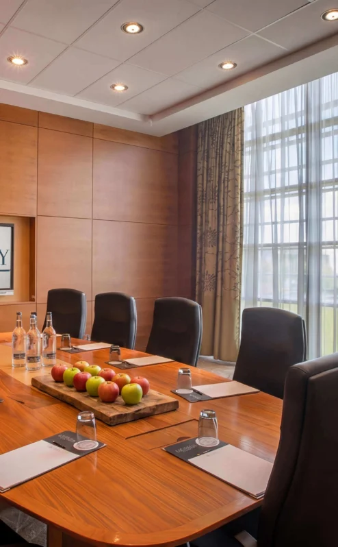 Elegant conference room with a polished table, ready for a business meeting at The Gateway Hotel Dundalk.