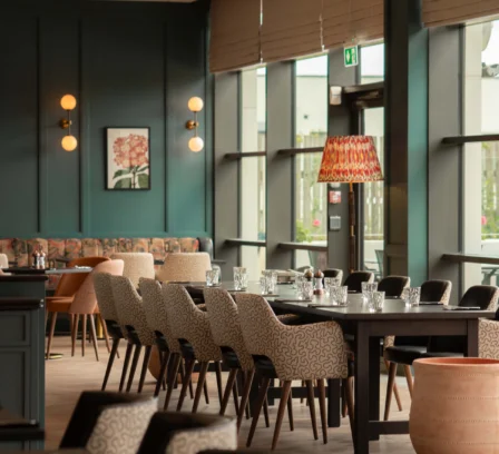Stylish hotel dining area with elegant seating and soft lighting.