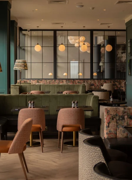 A cosy family dining area in The Gateway Hotel Dundalk with plush seating and elegant lighting.