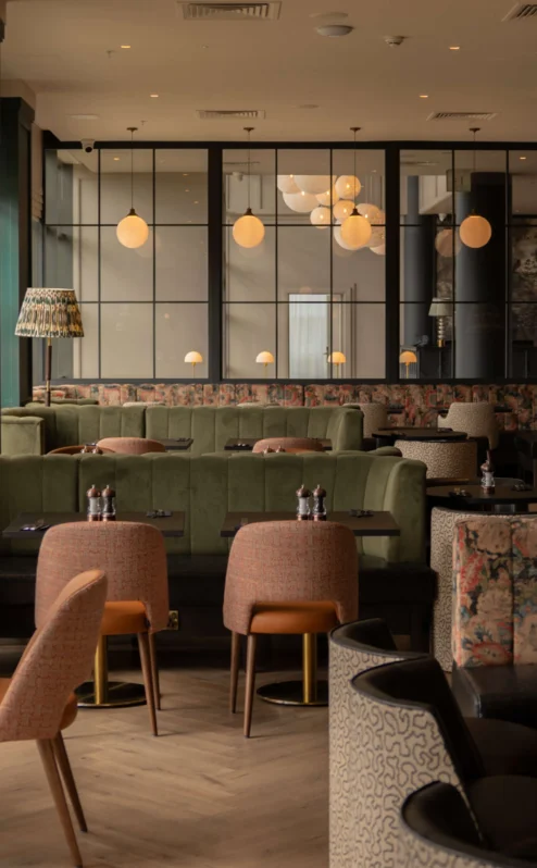A cosy family dining area in The Gateway Hotel Dundalk with plush seating and elegant lighting.