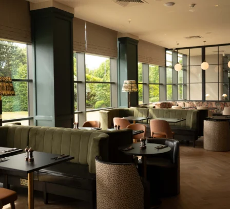 Spacious and cosy dining area at The Gateway Hotel Dundalk with natural light and elegant decor.