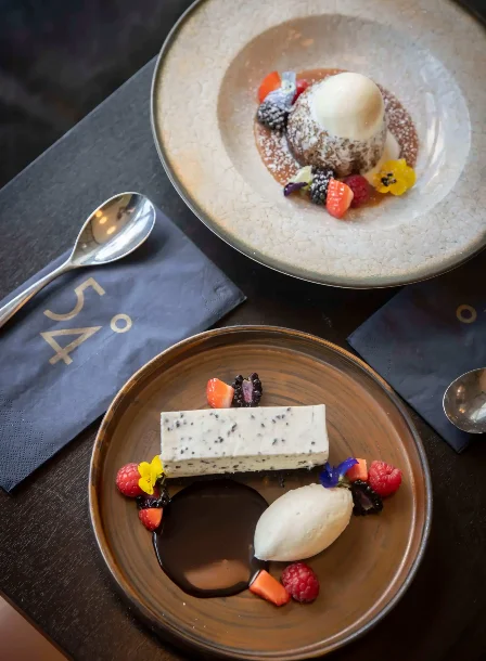Elegant desserts at The Gateway Hotel Dundalk, featuring ice cream and chocolate garnishes.