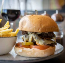 Gourmet burger and chips served at The Gateway Hotel restaurant.