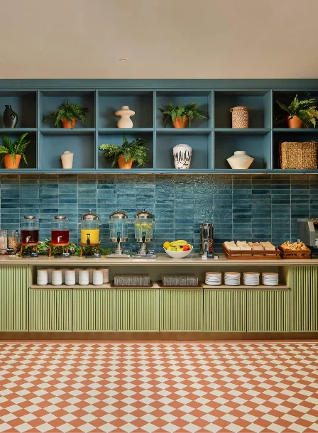 Elegant hotel breakfast area with buffet and stylish decor.