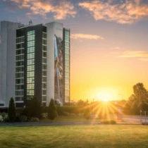 Family enjoying sunset at The Gateway Hotel Dundalk with lush green surroundings.
