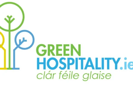 Green Hospitality logo with eco-friendly tree design and text in Irish.
